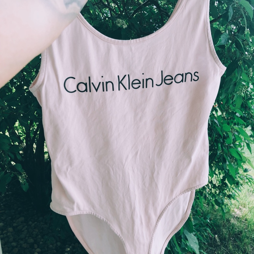 Pink Calvin Klein body suit